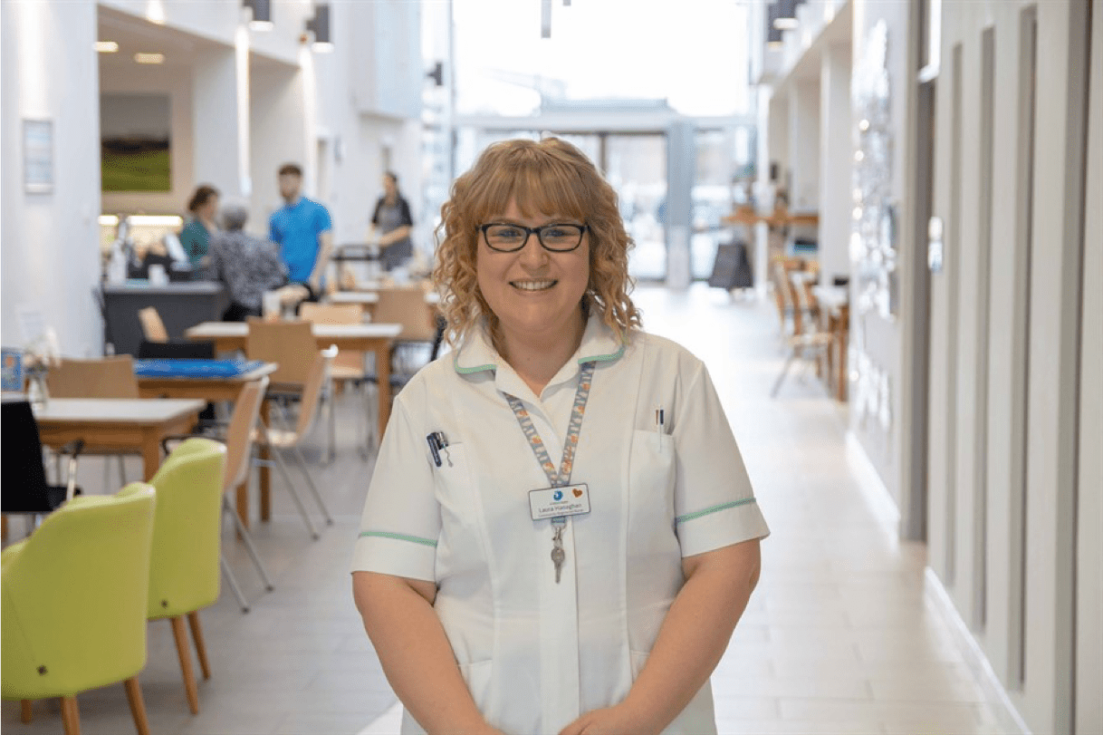 Hero Nurse in the hospice cafe smiling