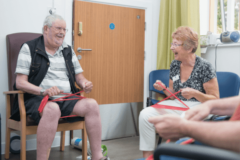 Gym session with volunteer and patient - smiling