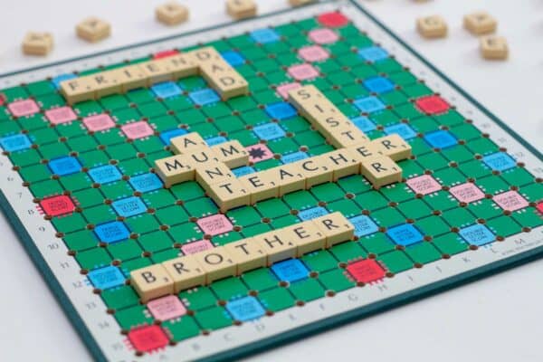 6330 Scrabble board with words on. Friend. Dad. Mum. Aunt. Sister. Teacher. Brother.