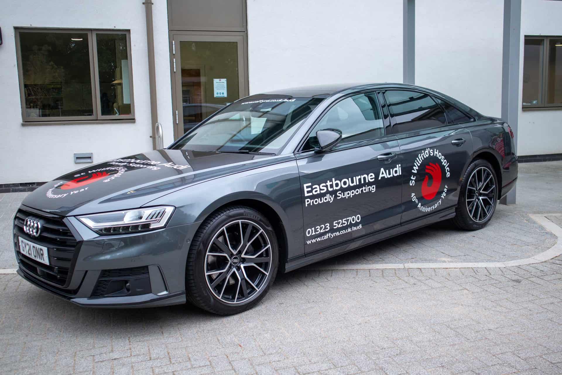 Audi A6 car branded with St Wilfrids logo