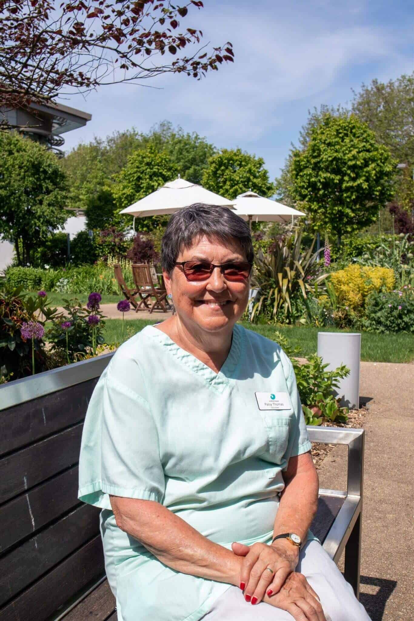 Patsy Thomas sitting in hospice garden