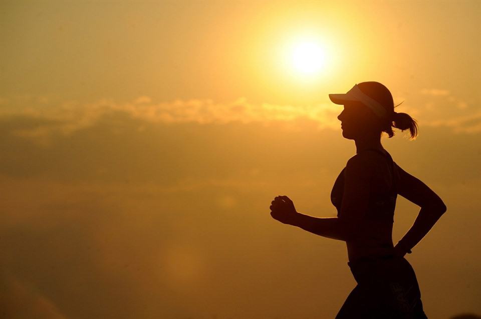 Runner against sunset background