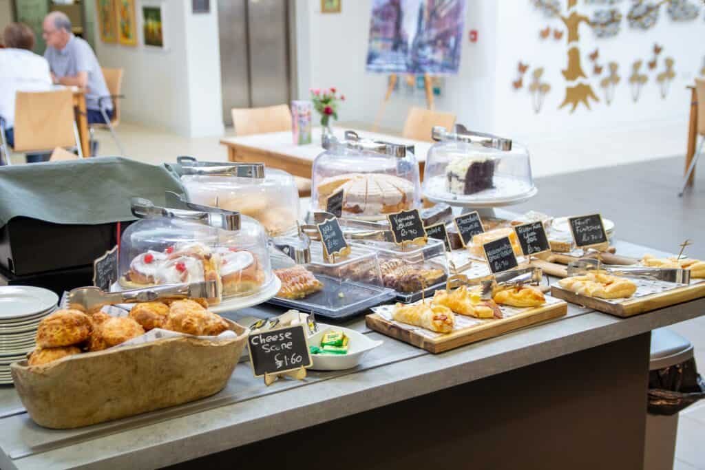 display of cakes in hospice cafe