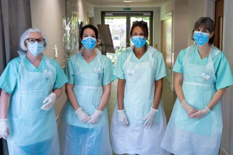 HospiceLife May2020 35 Four nurses in full ppe on IPU