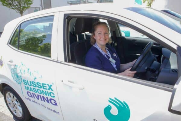 Olivia Beeney Bennett Nurse driving community car