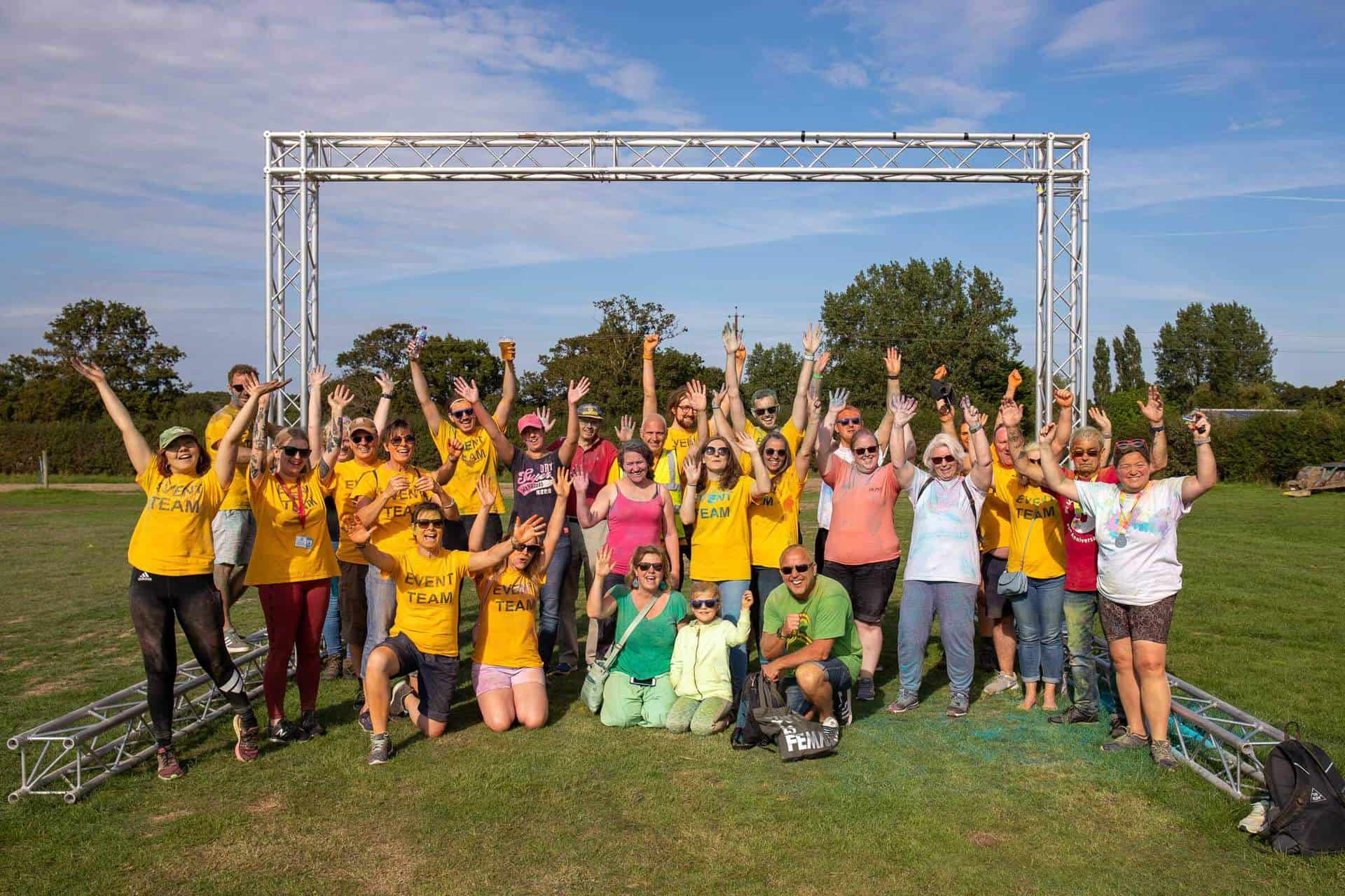 Volunteer group in yellow T-shirts at Rainbow Run