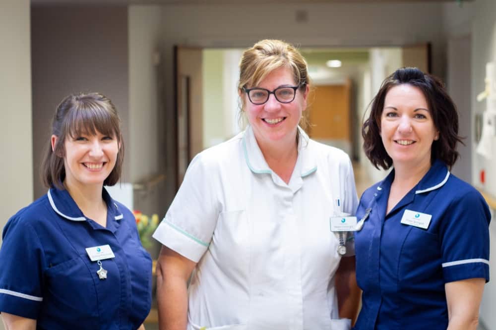 Three nurses smiling on IPU