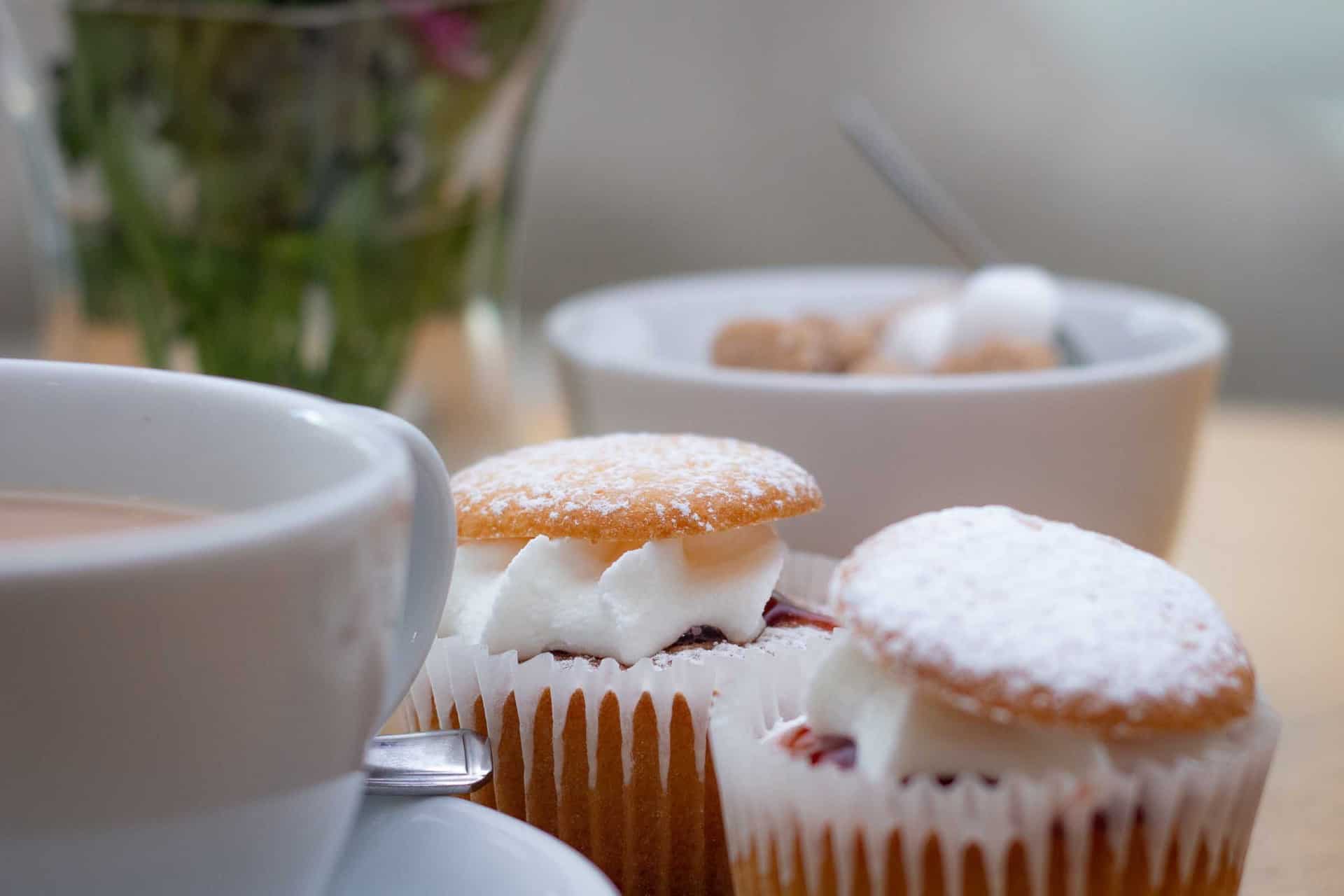 Close up of Cup of tea and two small cakes in the hospice cafe