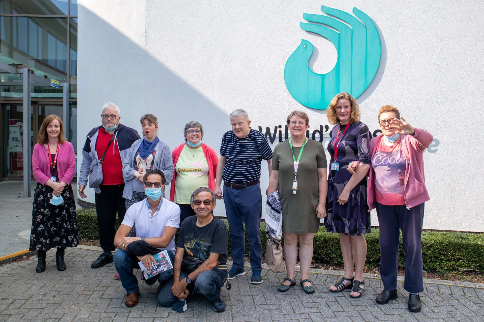 Sue Marsden and Lucy Cheshire with a group from Mencap Eastbourne outside the hospice