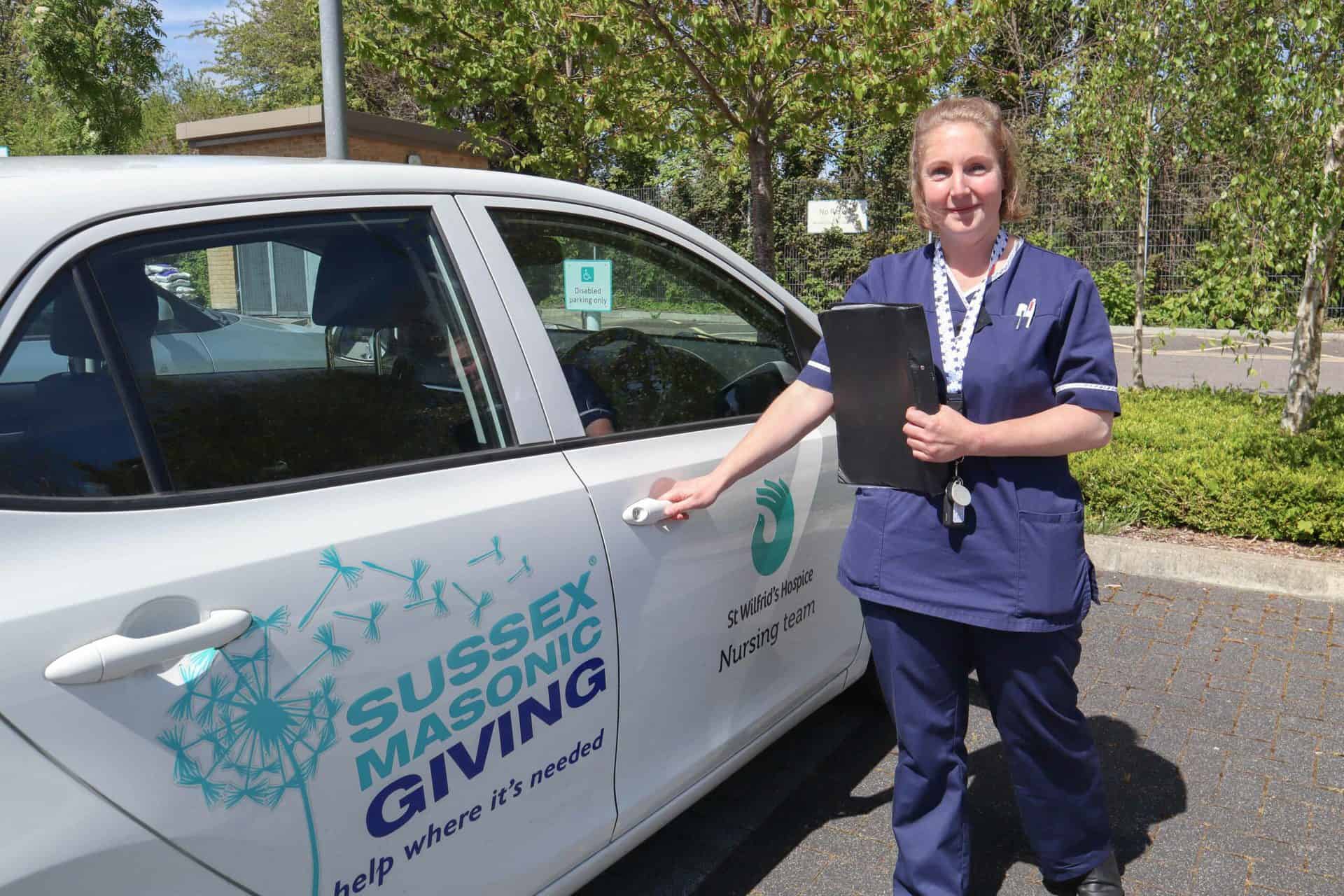 Nurse entering car