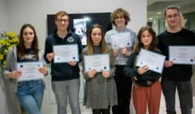 A group of 6 young people holding certificates