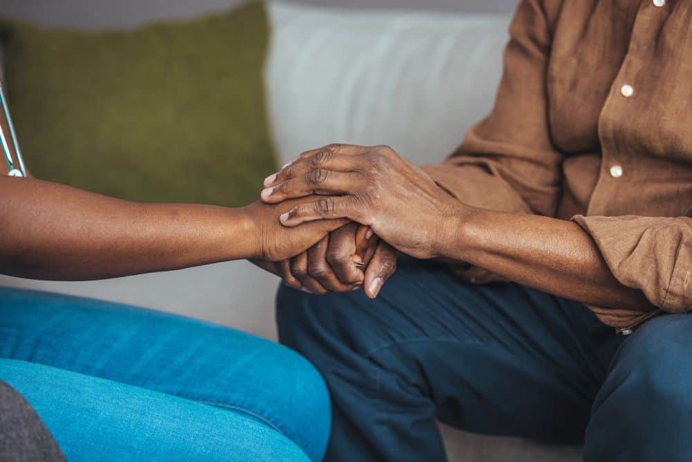 two people holding hands
