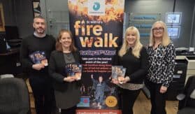 people standing by Fire Walk sign