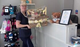 lady holding a raffle basket