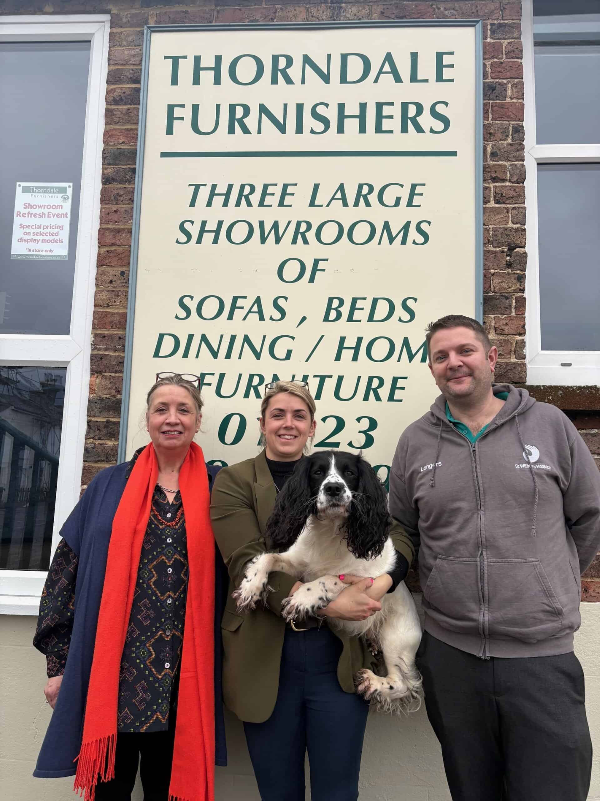 three people and dog