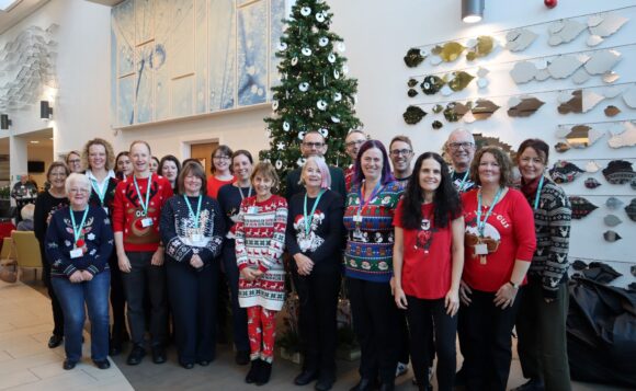 staff with christmas jumpers